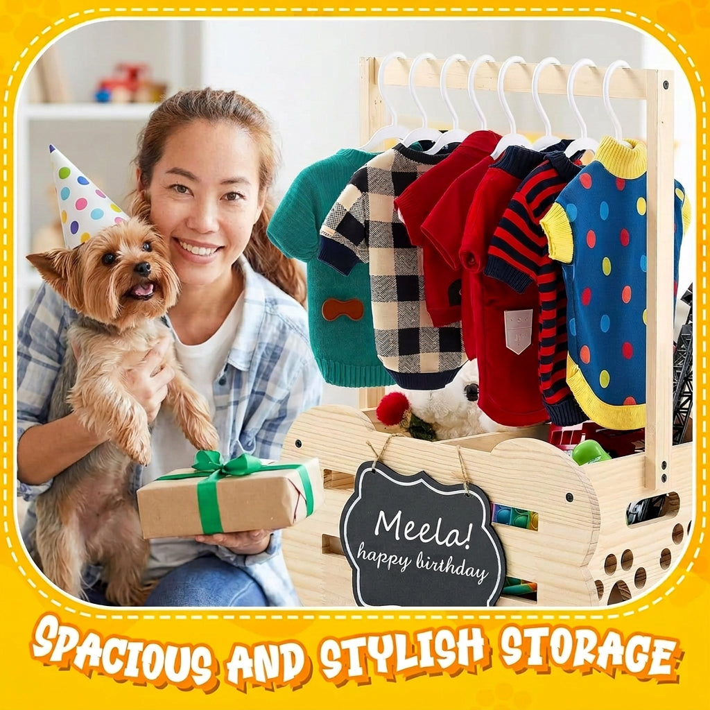 Woman with dog and birthday-themed clothing rack with colorful shirts